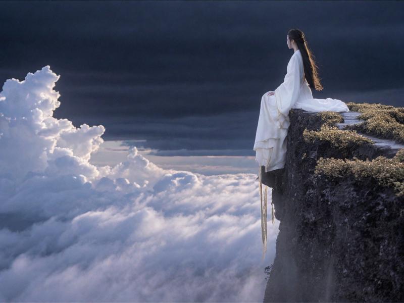 12603-3900732166-In the vast and empty sky,a white figure is slowly walking on a cloud. She is dressed in a white and gold Hanfu,her long hair fl.png